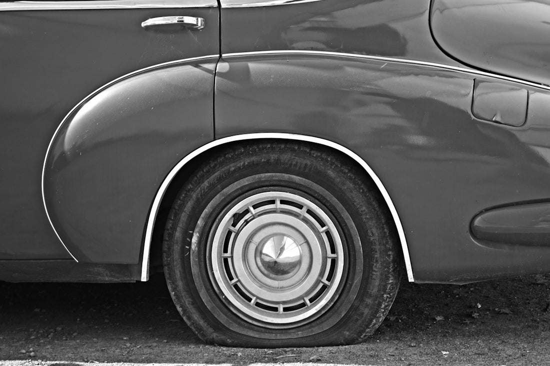 A black and white photo of an old car